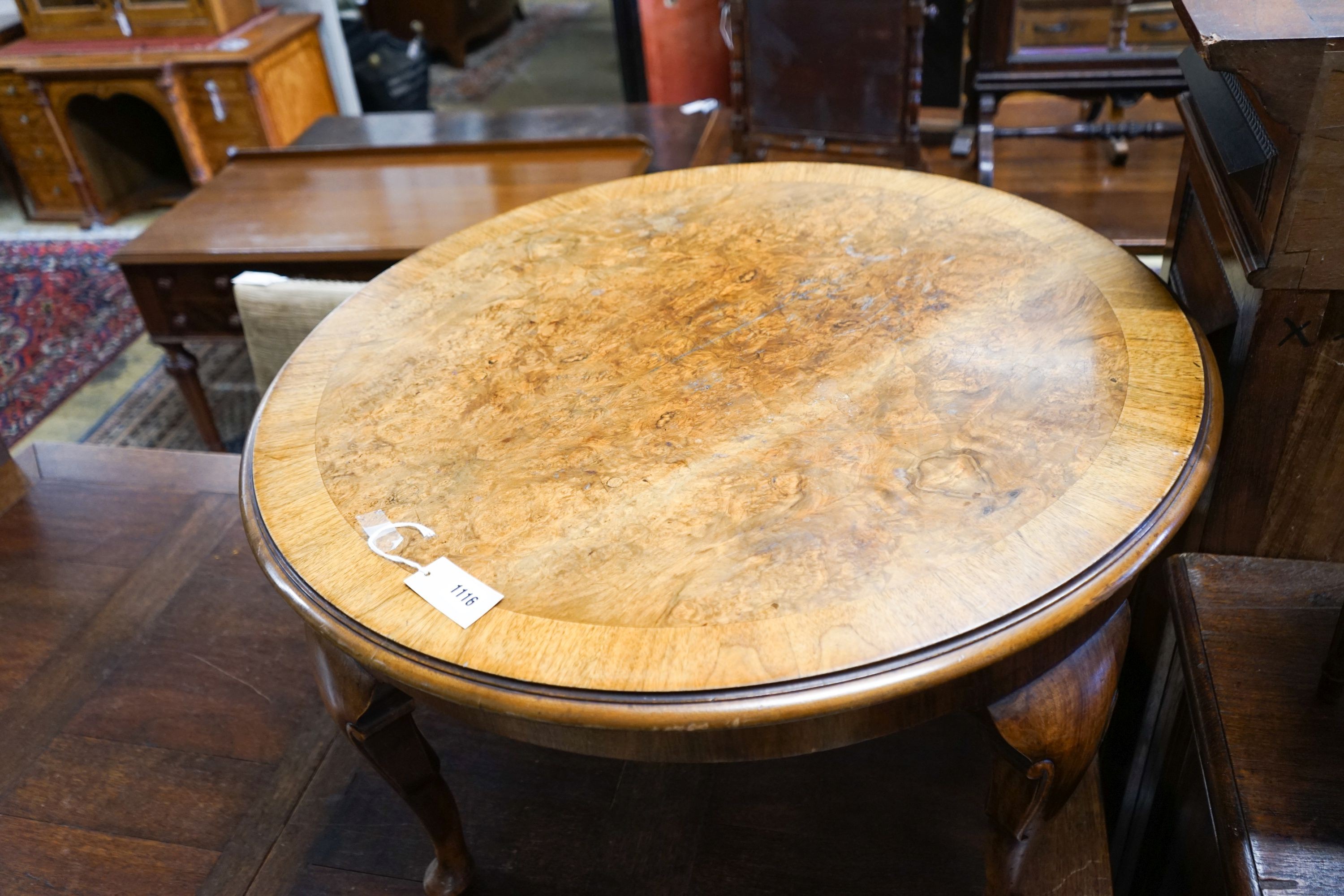 A circular burr walnut cabriole leg coffee table, diameter 84cm, height 47cm together with two Continental mahogany side tables with fretted brass galleries